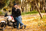 young couple on motorcycle laugh