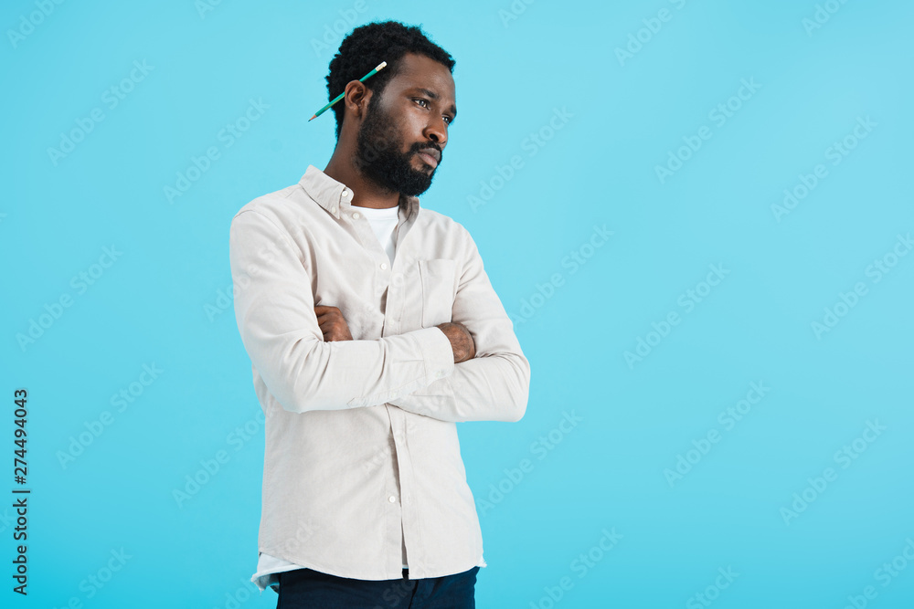 pensive african american man with pencil isolated on blue pensive african american man with pencil isolated on blue