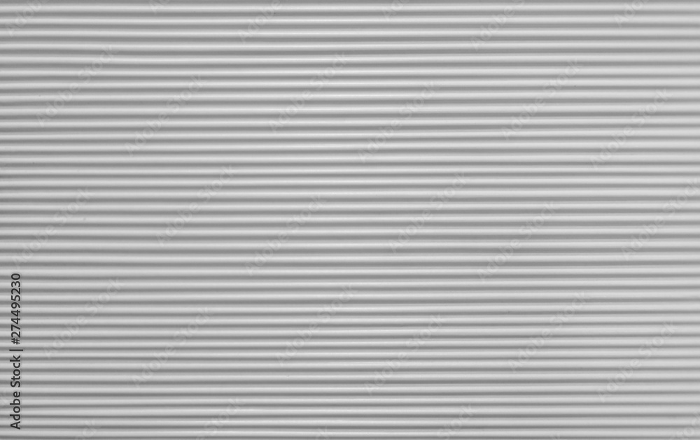 horizontal strips of cement on the wall of the building are white and gray horizontal strips of cement on the wall of the building are white and gray