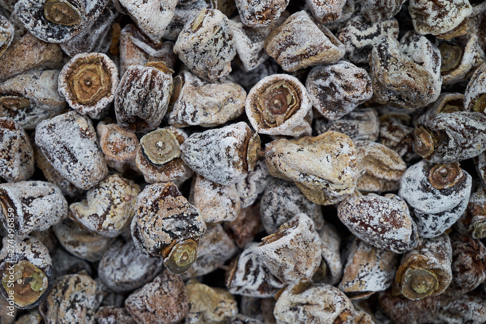 Dried persimmon texture background, close-up, top view. Preserved persimmon Dried persimmon texture background, close-up, top view. Preserved persimmon