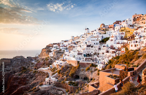 impressive evening view of Santorini island. Picturesque spring sunset on the famous Greek resort Oia, Greece, Europe. Traveling concept background. © Melinda Nagy
