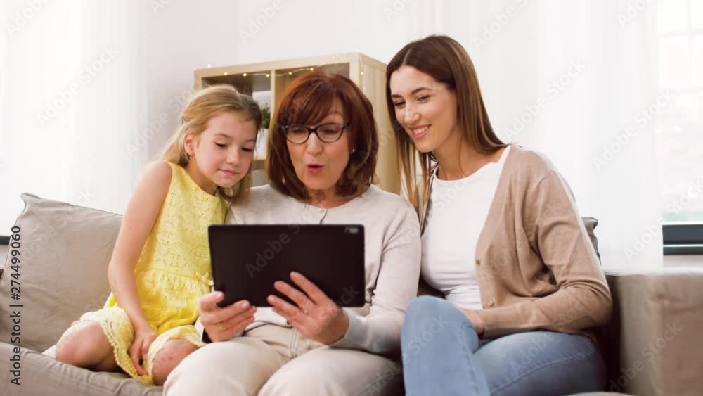 family, three generations and technology concept - happy mother, daughter and grandmother having video call tablet computer and waving hands at home family, three generations and technology concept - happy mother, daughter and grandmother having video call tablet computer and waving hands at home