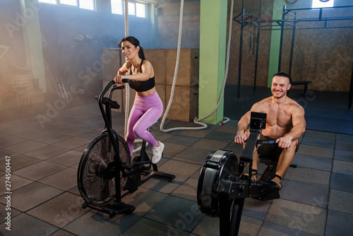 Caucasian sport man and woman during training in the gym.