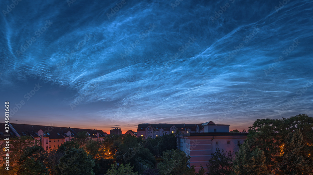 Noctilucent clouds above the city Mannheim in Germany, photographed on June 21, 2019.