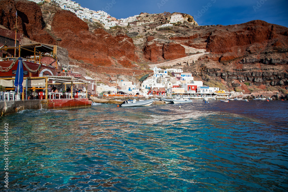 beautiful Oia town and caldera from old port Amoudi, Santorini island in Aegean sea, Greece