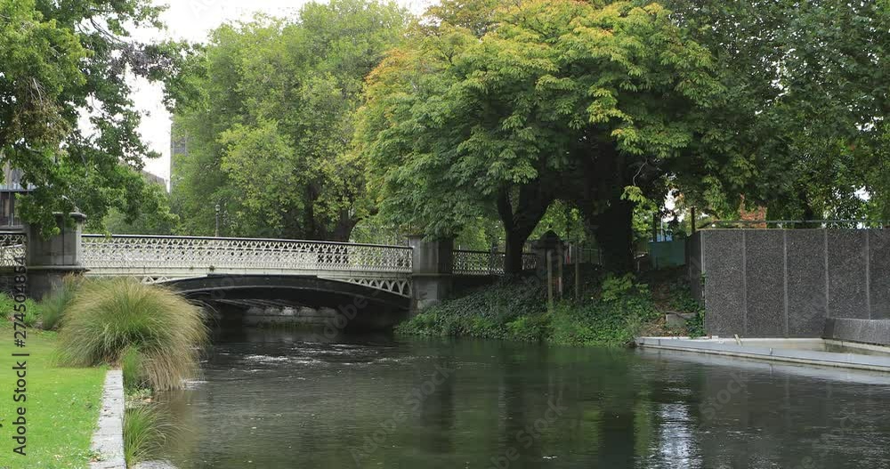 Tree lined river with bridge in Christchurch, New Zealand 4K Tree lined river with bridge in Christchurch, New Zealand 4K