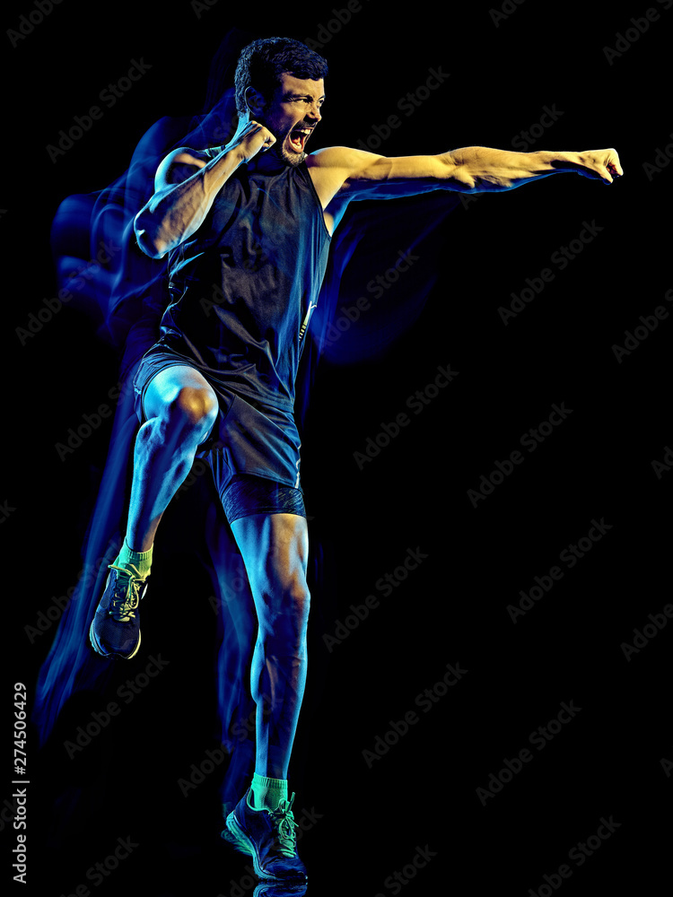one caucasian player man exercising fitness cardio boxing exercise body  combat studio shot isolated on black background with light painting blur  effect Stock Photo | Adobe Stock
