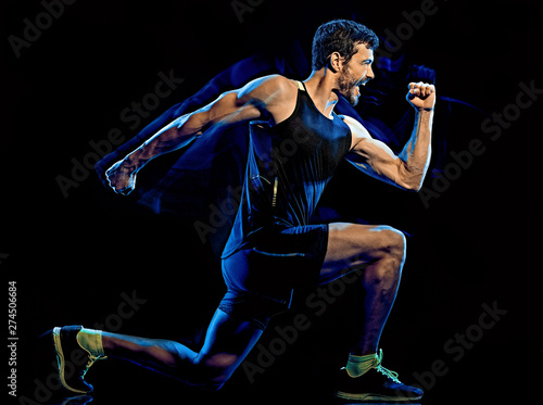 one caucasian player man exercising fitness cardio boxing exercise body combat studio shot isolated on black background with light painting blur effect © snaptitude