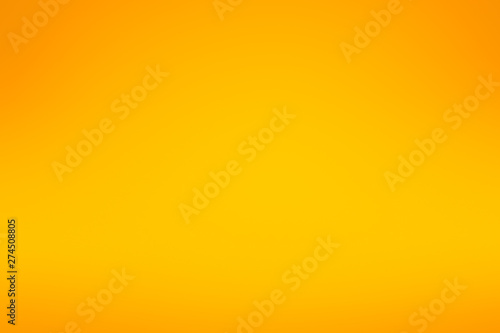 Abstract blurred vibrant orange with gradient vignette background.