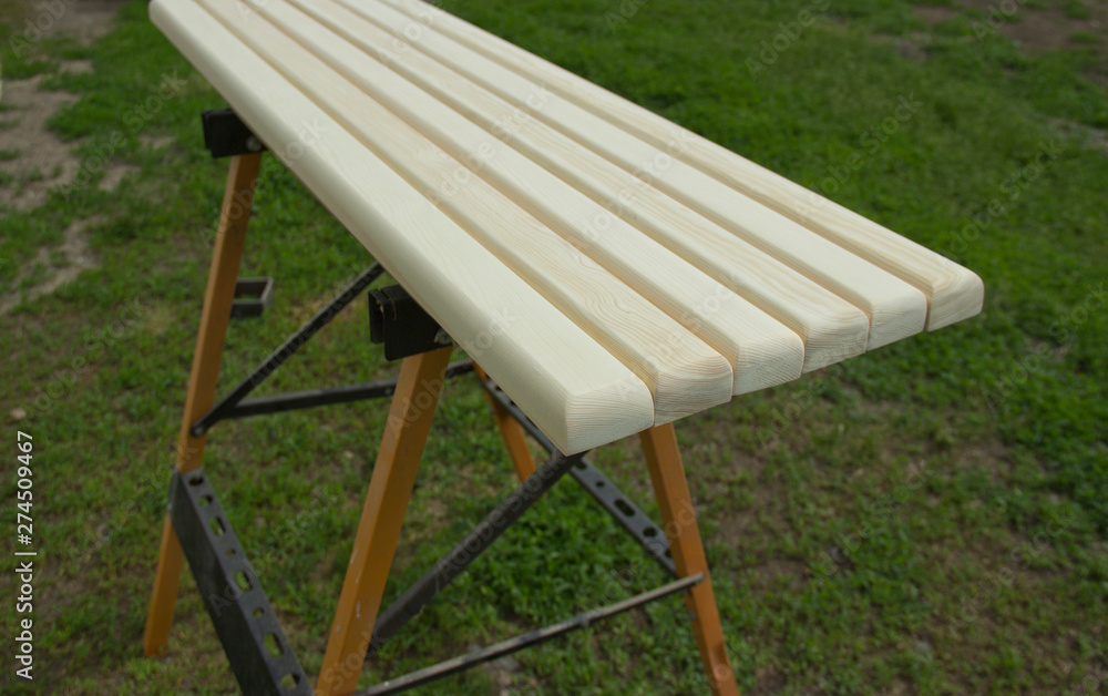polished wooden bars on a natural background. polished wooden bars on a natural background.