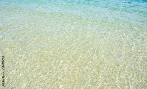 Clear sea water photos can see the white sand.