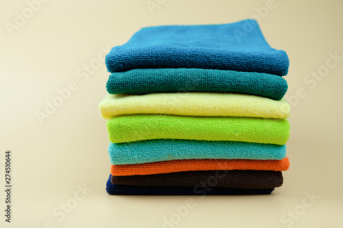 Set of multicolored folded towels pile