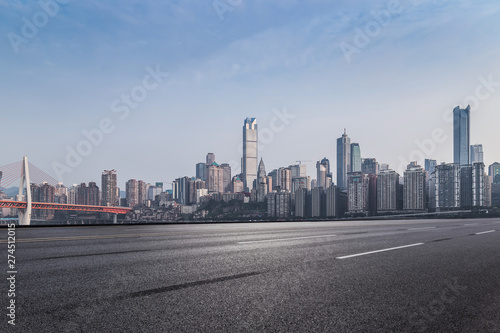 skyline view of chongqing, with empty asphalt road, in china. © duan
