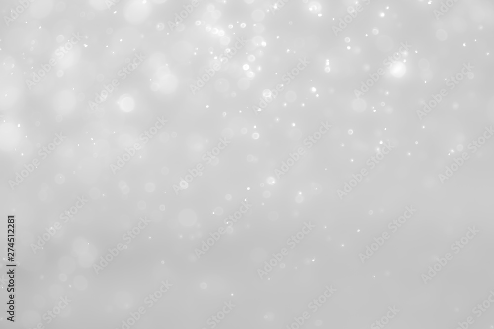 Fototapeta premium Białe i srebrne światła na streszczenie tło bokeh.