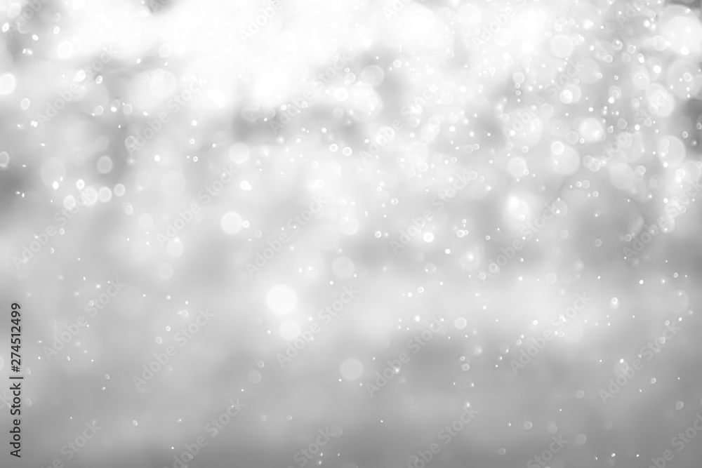 Fototapeta premium Białe i srebrne światła na streszczenie tło bokeh.
