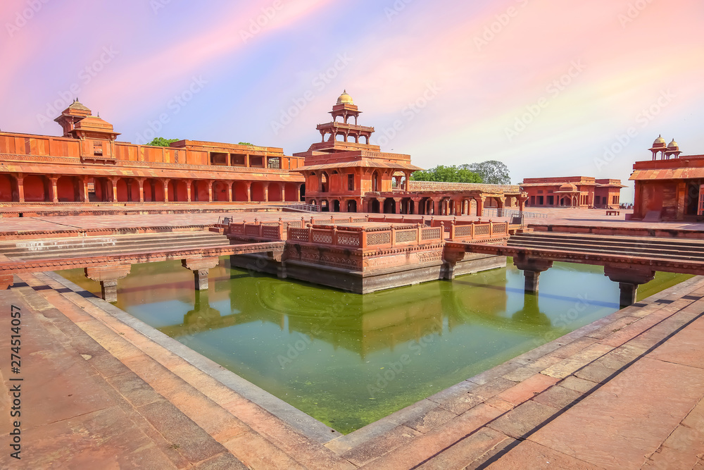 Fatehpur Sikri ancient fort city with view of Anup Talao a concert stage surrounded by water with view of ancient architecture at Agra India