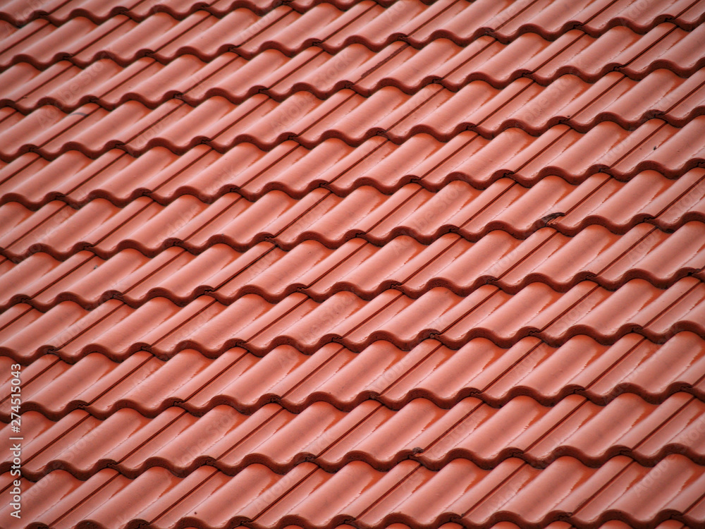 Red ceramic roof tiles, close up detail on house roof, seamless pattern background. Red ceramic roof tiles, close up detail on house roof, seamless pattern background.