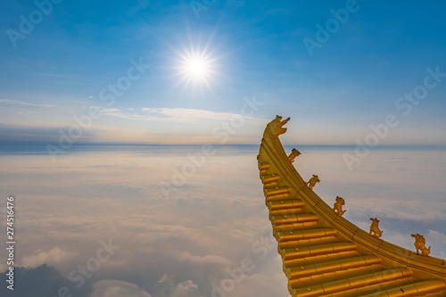 The cornice of the golden temple, the golden roof of Emei mountain in Sichuan province, China photo