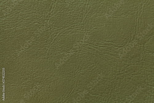 Dark olive leather texture background, closeup. Green cracked backdrop