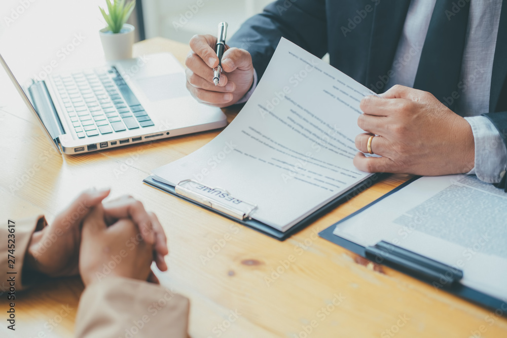 Attractive young business woman in a job interview with a corporate personnel manager Attractive young business woman in a job interview with a corporate personnel manager