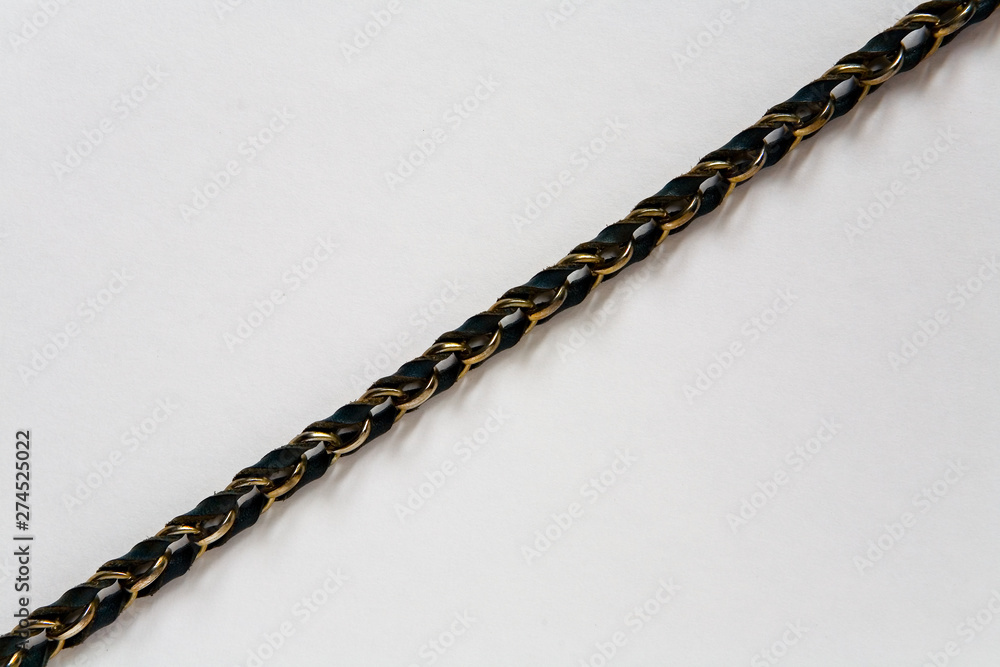 Braided strap on a light background. Braided strap on a light background.