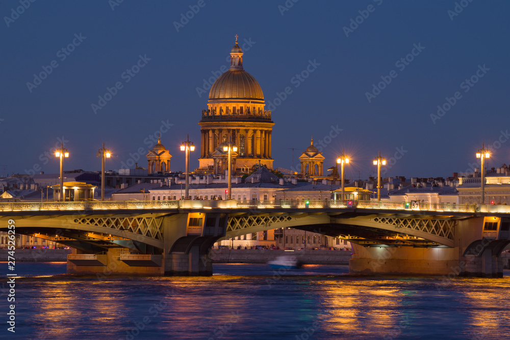 The dome of old St. Isaac Cathedral over the Blagoveshchensk bridge on a white night. Saint-Petersburg, Russia