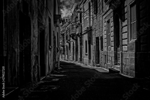 An old narrow street in Rabat, Malta in black and white