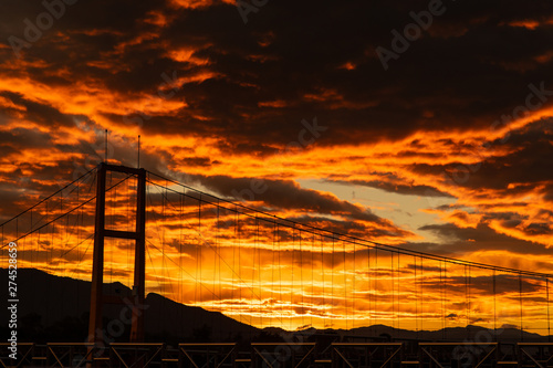 Sunset color blood in the evening with mountains and rivers