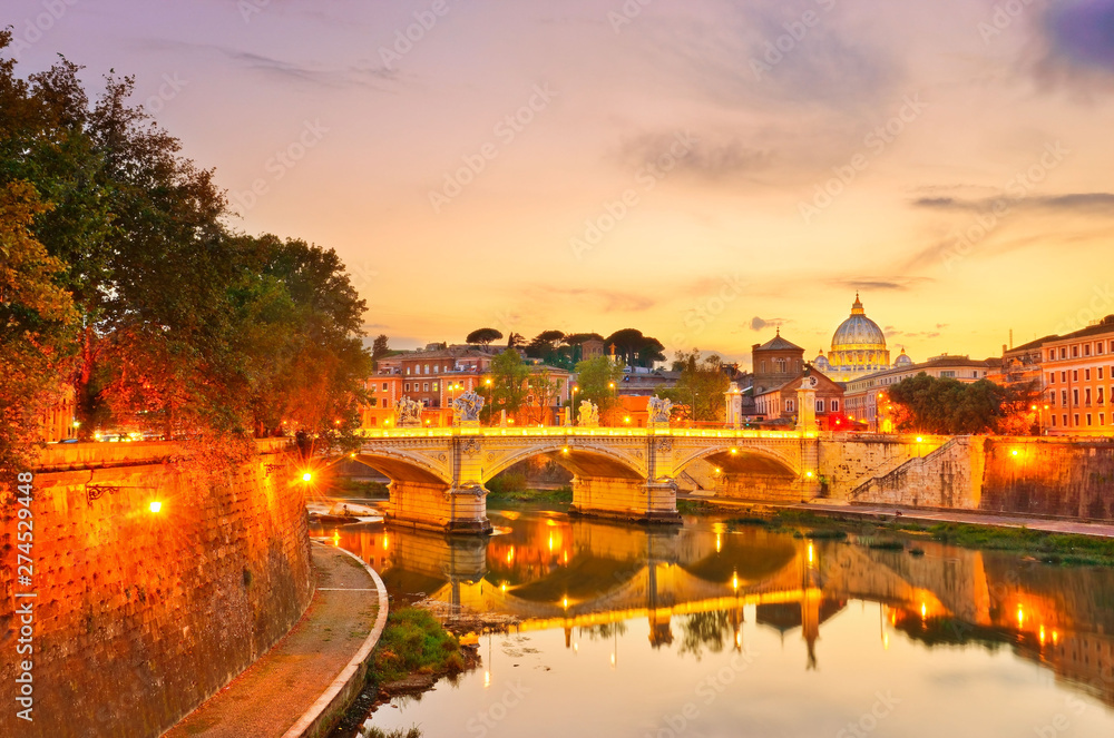 Fototapeta premium View of St. Peter's Basilica and Bridge King Victor Emmanuel II in Rome at sunset.