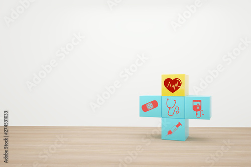 Minimal concept idea about of health and medical insurance, arranging block color stacking with icon healthcare medical on wooden background.