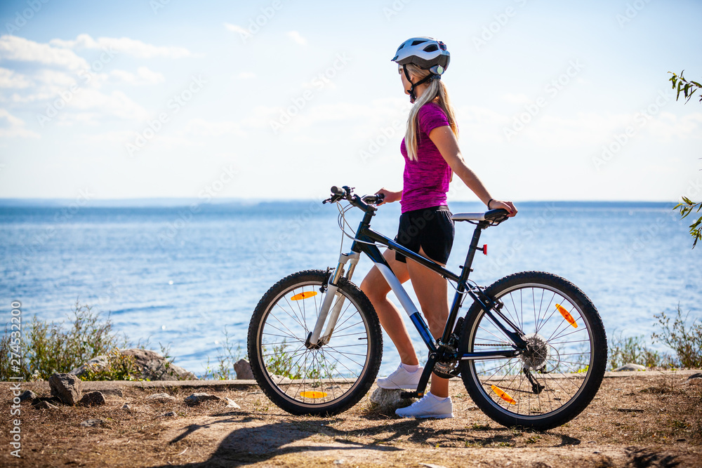 Fototapeta premium Young woman cycling