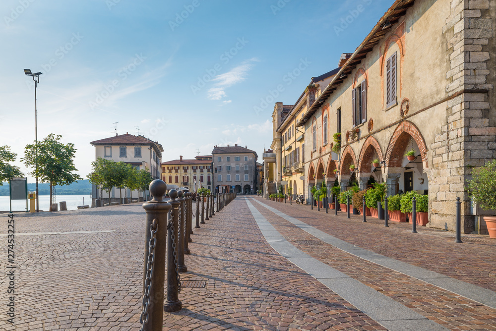 Picturesque town on lake. Historic center of Arona, lake Maggiore, Italy. View of the piazza del Popolo, the oldest and most characteristic part of the village of Arona, province of Novara, Piedmont