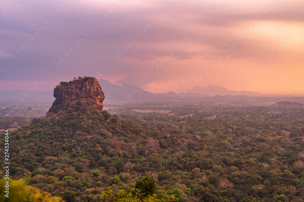 Pidurangala Ancient Forest Monastery, Sigiriya, Sri Lanka - View of sigirya rock at sunset