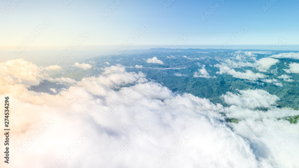 Aerial view white clouds and green mountains cover by fog, Mountains view landscape. Aerial view white clouds and green mountains cover by fog, Mountains view landscape.