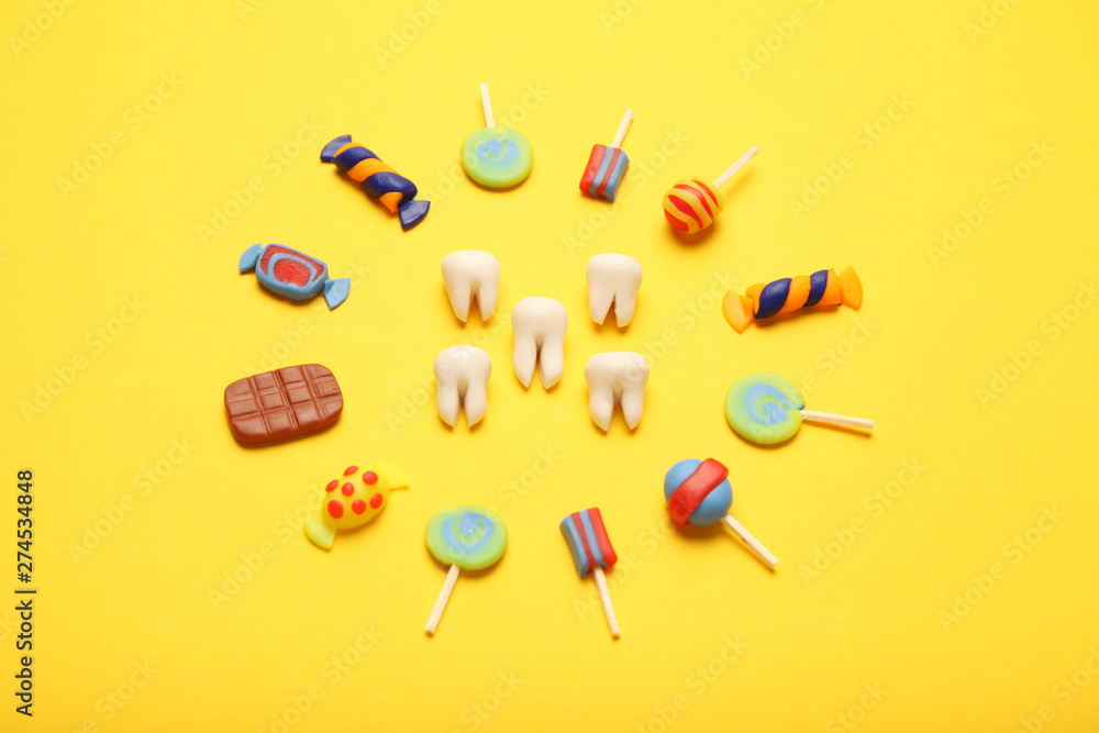 Teeth with sweet candies. Tooth caries in children's, dental healthcare. Teeth with sweet candies. Tooth caries in children's, dental healthcare.