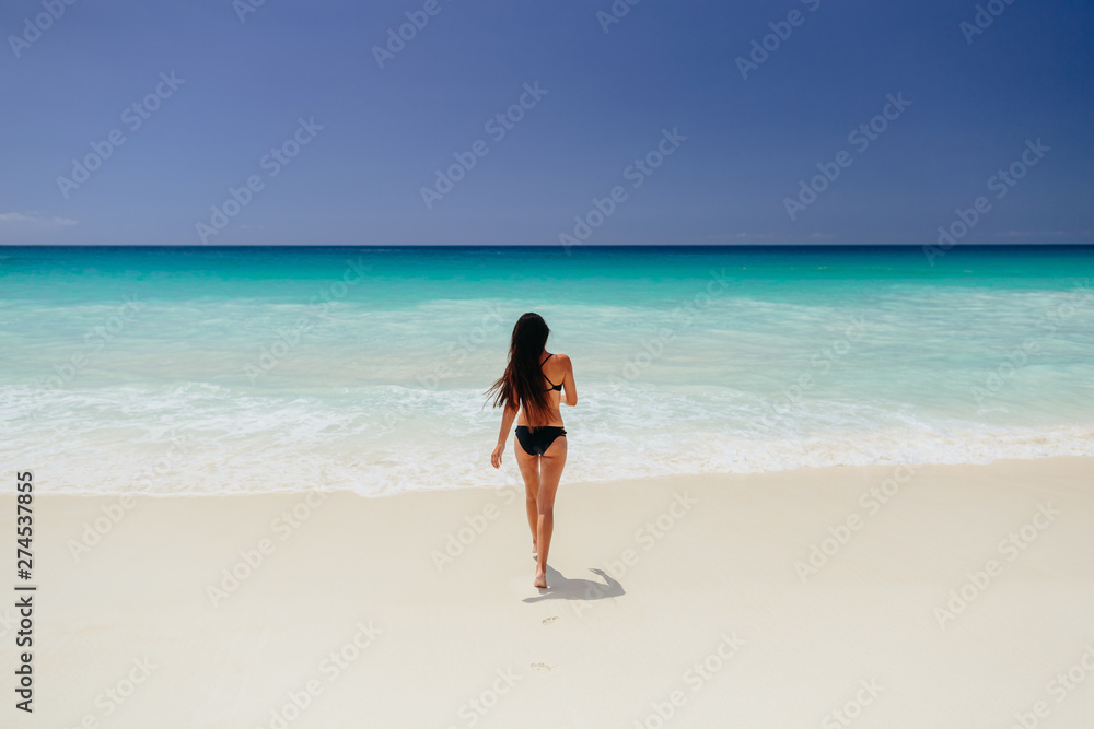 woman on beach vacation in tropics woman on beach vacation in tropics