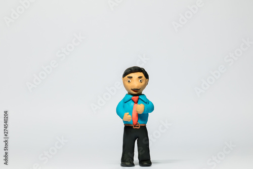 A businessman made from plasticine on white background, aligned in the center.
