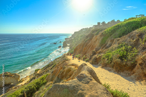 Panoramic view from coastal walk leading down to El Matador State Beach at sunlight. Pacific coast in California, United States. Pillars, boulders and rock formations of most photographed Malibu beach photo