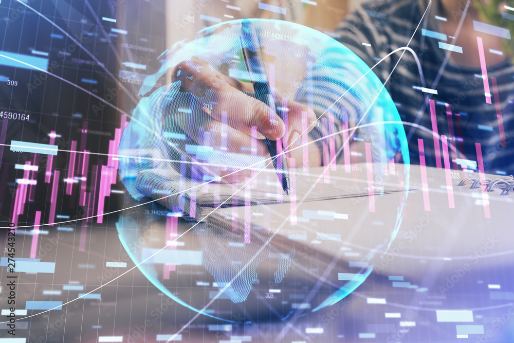 Financial forex graph drawn over hands taking notes background. Concept of research. Double exposure Financial forex graph drawn over hands taking notes background. Concept of research. Double exposure
