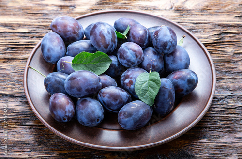 a plate of juicy ripe plums.