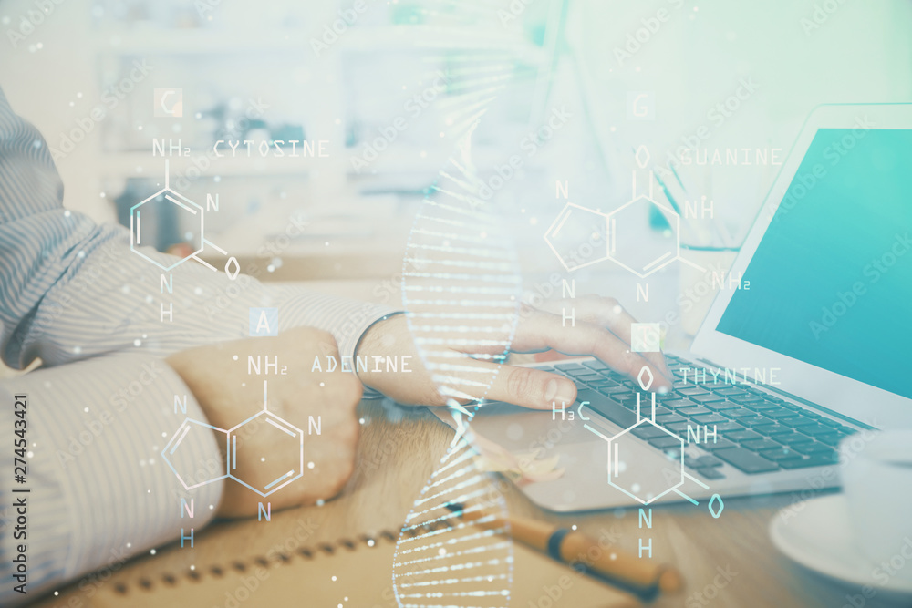 DNA hologram with businessman working on computer on background. Concept of bioengineering. Double exposure. DNA hologram with businessman working on computer on background. Concept of bioengineering. Double exposure.
