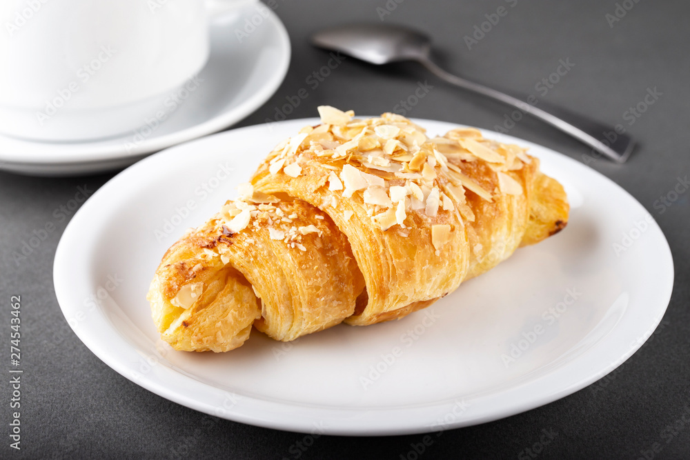 freshly baked croissants on a plate.