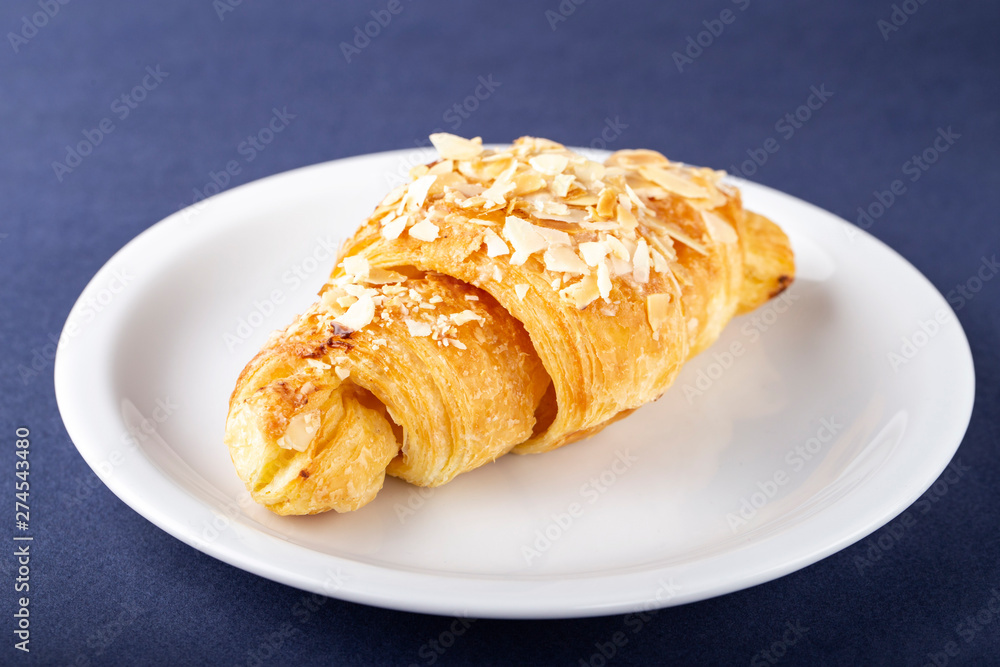 freshly baked croissants on a plate. freshly baked croissants on a plate.