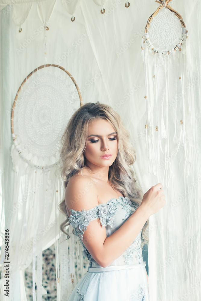 Portrait of young beauty woman with blonde curly hair at home. Romantic location Portrait of young beauty woman with blonde curly hair at home. Romantic location
