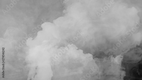 Abstract smoke steam moves on a black background . The concept of aromatherapy