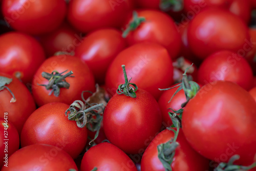 Group of fresh tomatoes. Small red cherry tomatoes