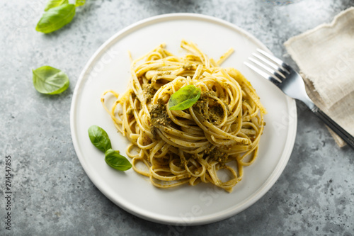 Homemade pasta with pesto sauce