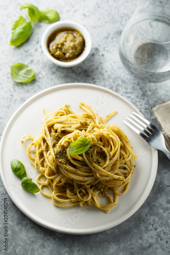 Homemade pasta with pesto sauce