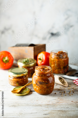 Homemade roasted vegetables sauce in jars