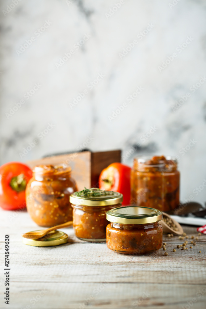Homemade roasted vegetables sauce in jars Homemade roasted vegetables sauce in jars